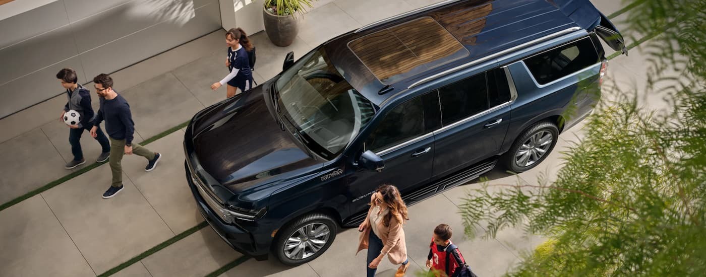 Dark blue 2023 Chevy Suburban parked in a driveway
