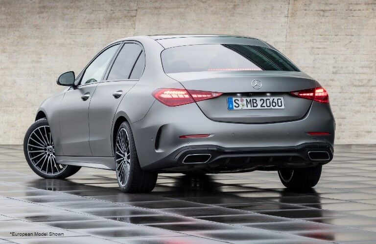 2022 Mercedes-Benz C-Class exterior rear fascia driver side in front of brick wall