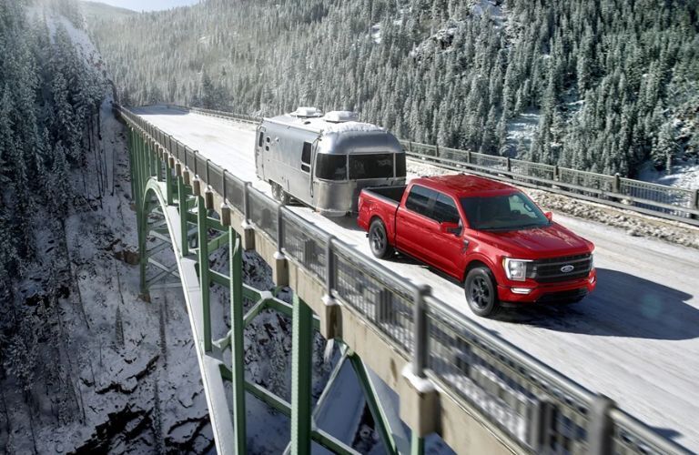 2023 Ford F-150 Red towing a trailer