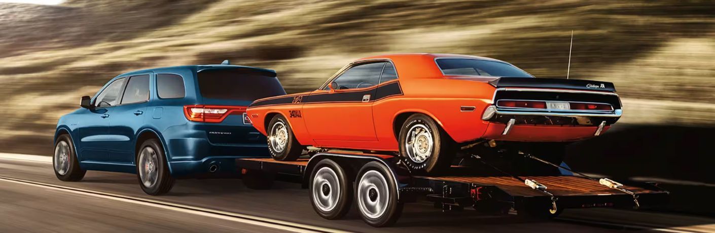2024 Dodge Durango Blue towing a car