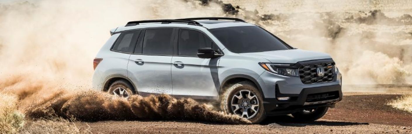 The 2022 Honda Passport on a dusty road