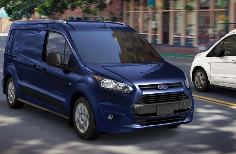 blue 2018 ford transit connect van driving in city