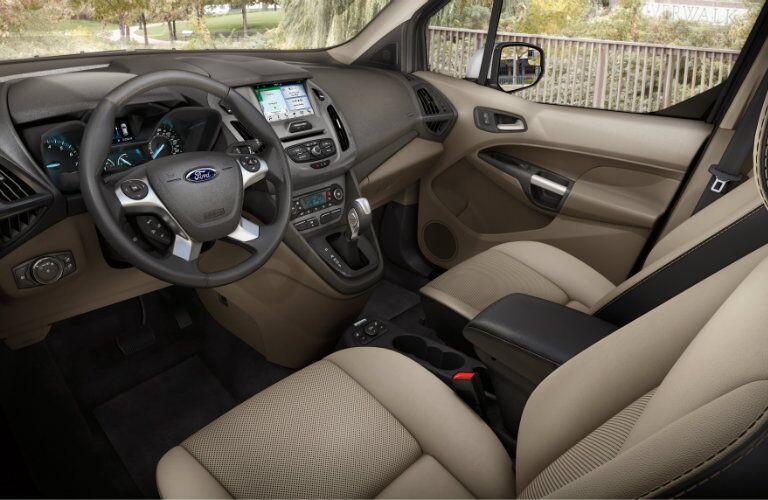 front interior of 2018 ford transit connect including seats and steering wheel