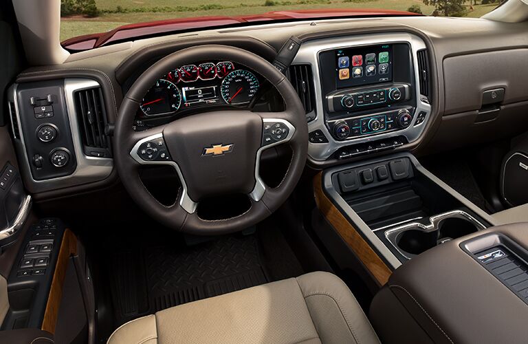 front interior of 2019 chevy silverado including steering wheel and infotainment system