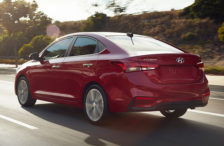 rear and side view of red 2019 hyundai accent