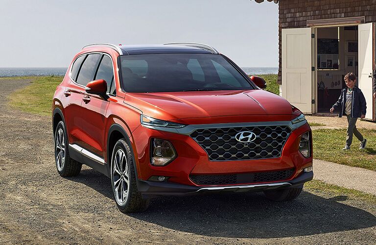 front and side view of red 2019 hyundai santa fe