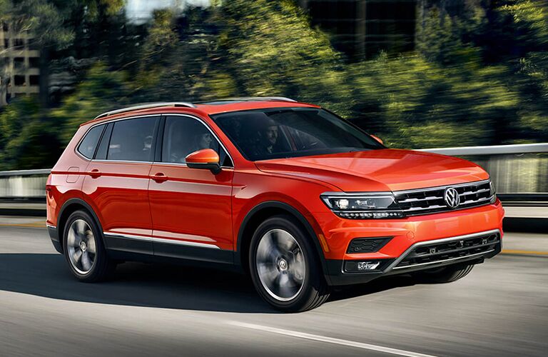 front and side view of orange 2019 volkswagen tiguan