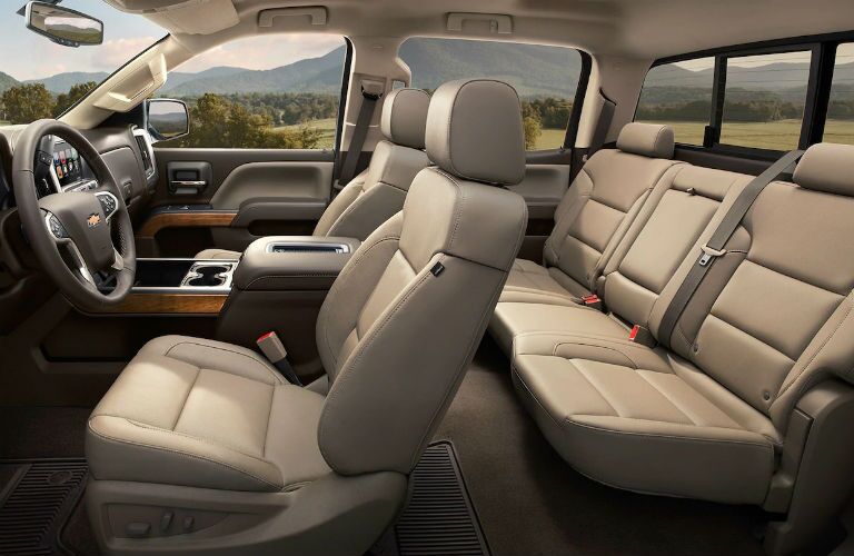 side view of interior of 2019 chevrolet silverado 2500 hd including front and rear seats