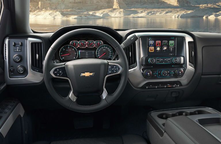 front interior of 2019 chevrolet silverado 2500hd including steering wheel and infotainment system