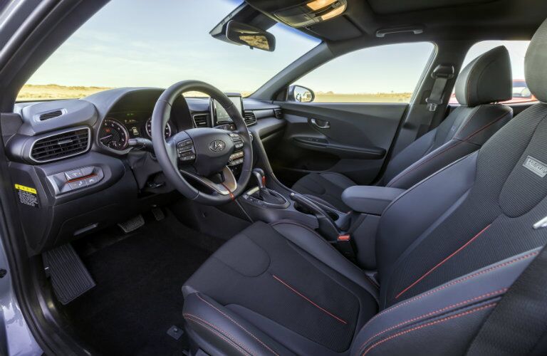 front interior of 2019 hyundai veloster including steering wheel and front seats