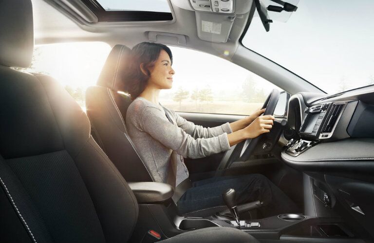 woman driving a 2017 Toyota RAV4