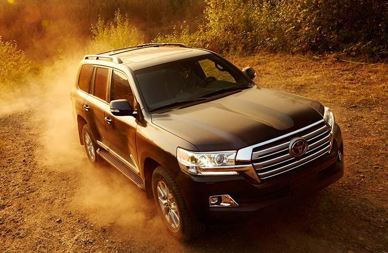 2018 Toyota Land Cruiser driving through sand and dust