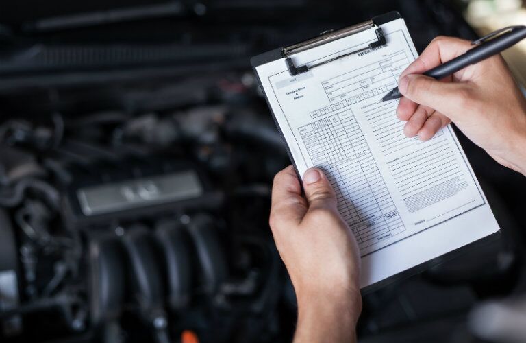 pre-purchase inspection checklist in front of engine