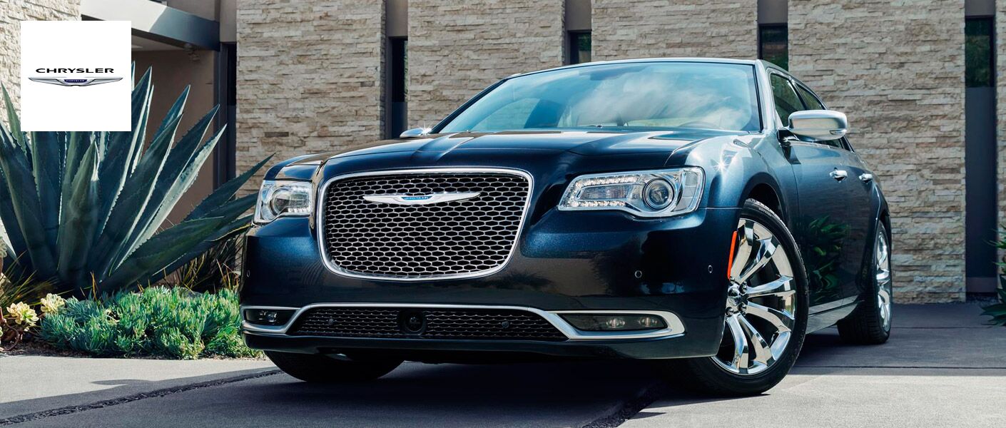 2015 Chrysler 300 Parked Next to Plants