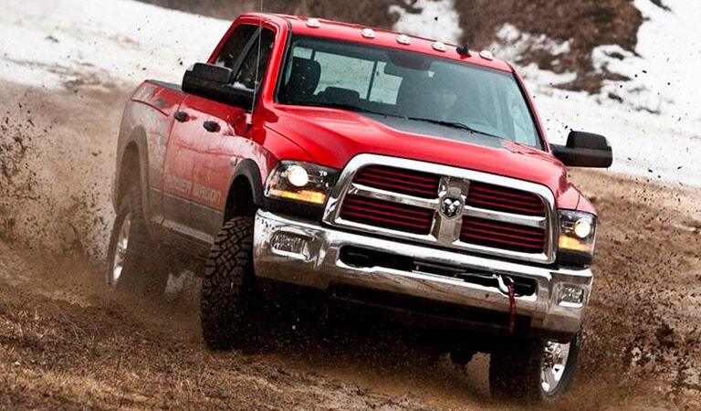 red 2018 Ram 2500 driving through the mud