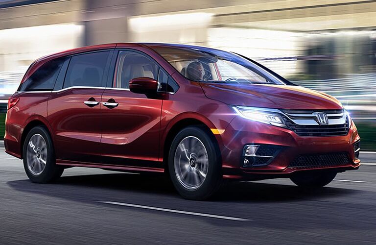 full view of the Honda Odyssey driving in the city