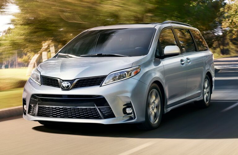 Toyota Sienna driving on a road