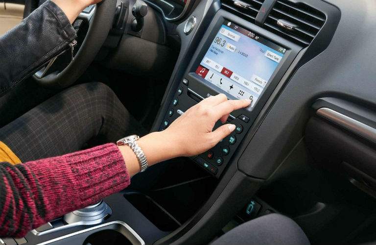 A close up photo of the infotainment system touchscreen in the 2018 Fusion Energi