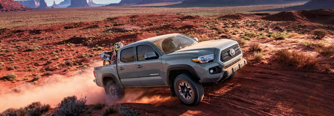 2018 Toyota Tacoma driving on dirt.