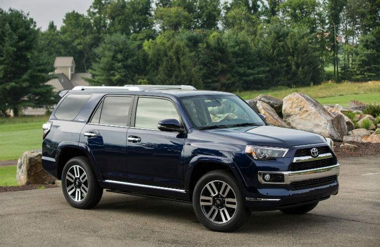 A front right profile view of a blue 2018 Toyota 4Runner in a parking lot