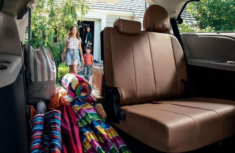 An interior photo showing part of the third row in the 2018 Sienna removed for cargo hauling needs