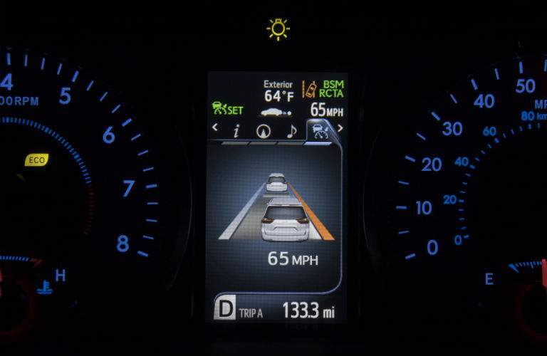 A close up photo of the driver information display showing the safety systems in action