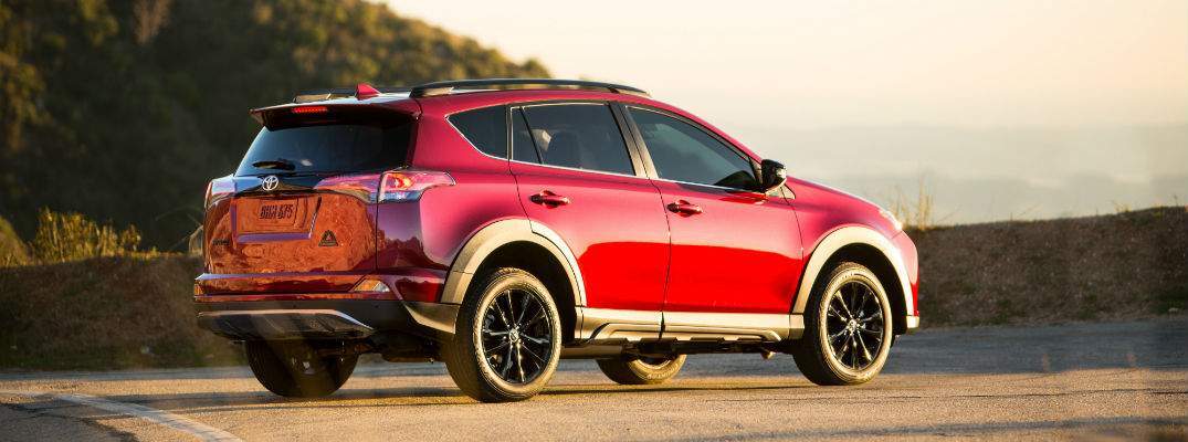 A right profile view of the 2018 Toyota RAV4 Adventure on a mountain road