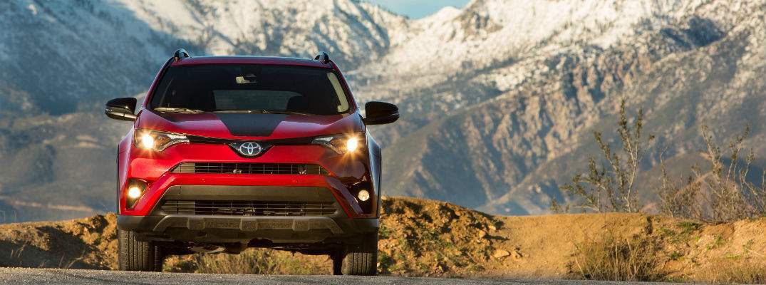 A straight on photo of the 2018 Toyota RAV4 Adventure driving down a mountain road