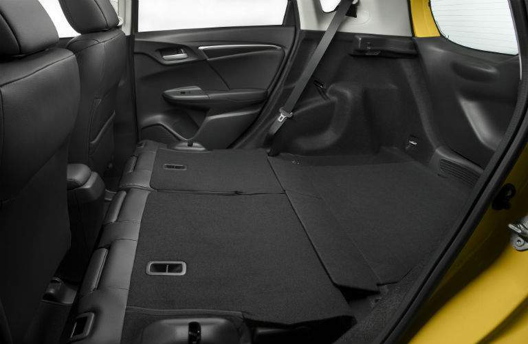 Rear seats folded flat in the rear of the 2018 Honda Fit