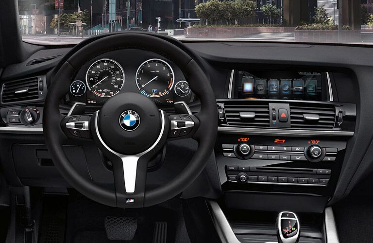 2017 BMW X4 steering wheel and dashboard view
