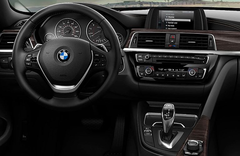 close view of the steering wheel and infotainment system of the 2018 BMW 4 Series
