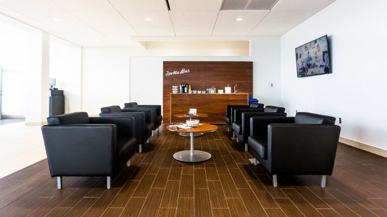 New BMW and Volkswagen of Topeka customer lounge with black chairs