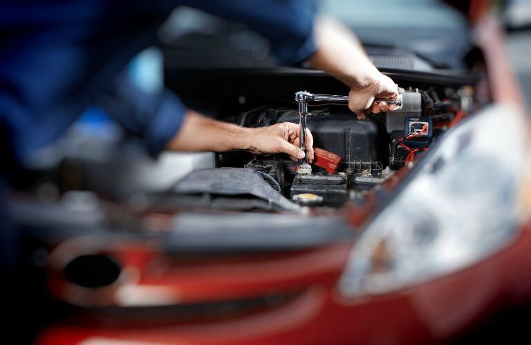 service technician working on a vehicle