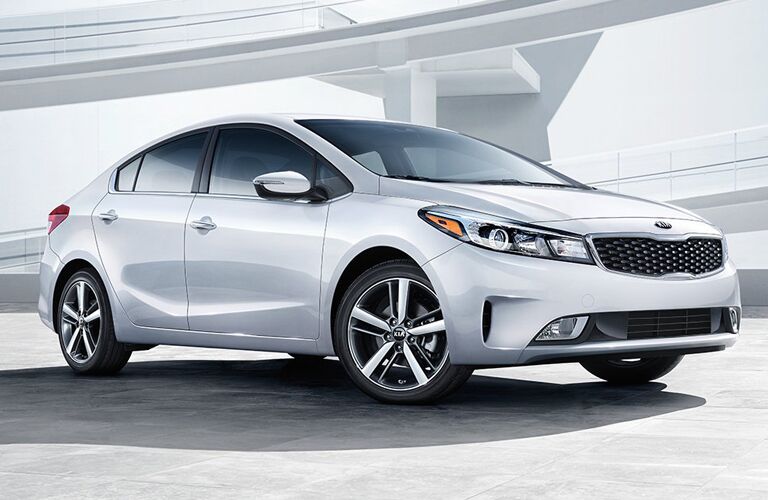 White Kia Forte parked