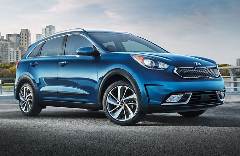 blue Kia Niro parked