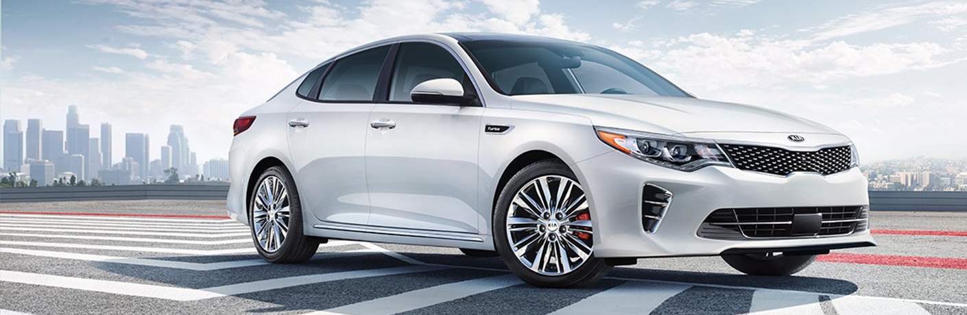 White 2018 Kia Optima parked