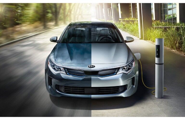 2019 Kia Optima Hybrid model plugged-in and charging at a station