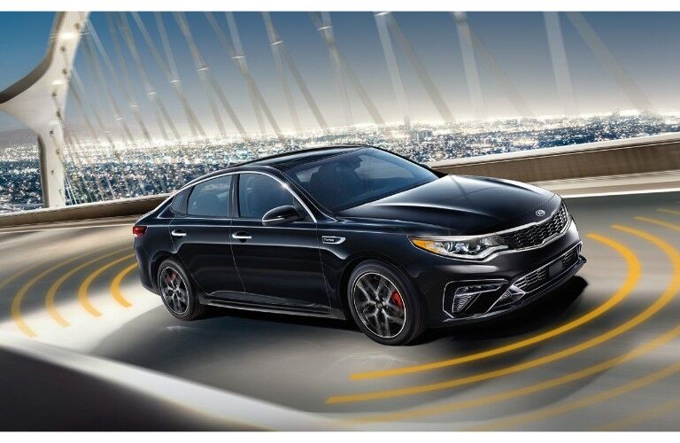 2019 Kia Optima exterior shot showing visual markers to display driver assistance sensors