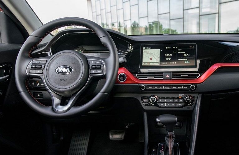 2020 Kia Niro interior shot of steering wheel, transmission, and dashboard layout