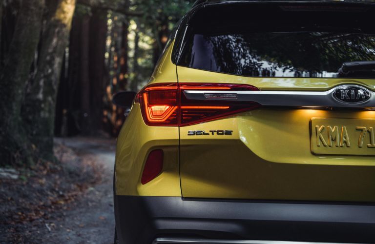 2021 Kia Seltos exterior rear shot of bumper, trunk, and taillights with Starbright Yellow paint color