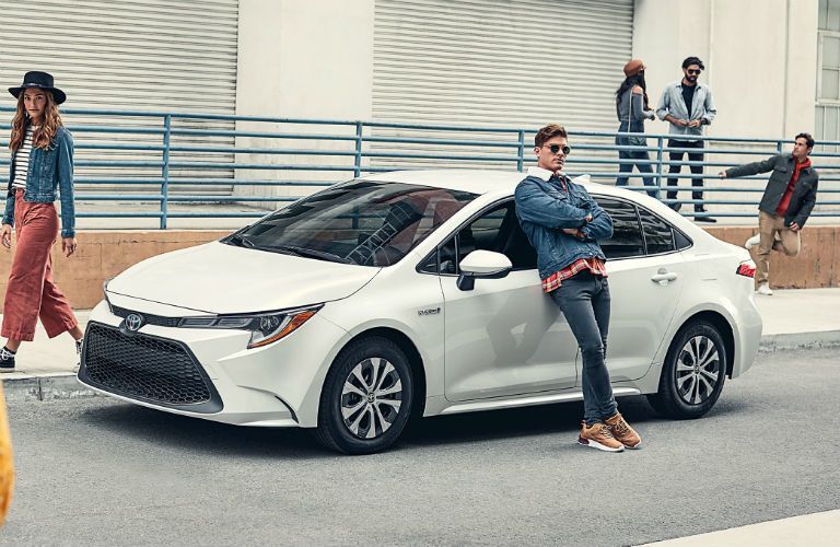 2020 Toyota Corolla Hybrid Exterior Driver Side Front Profile with People Around