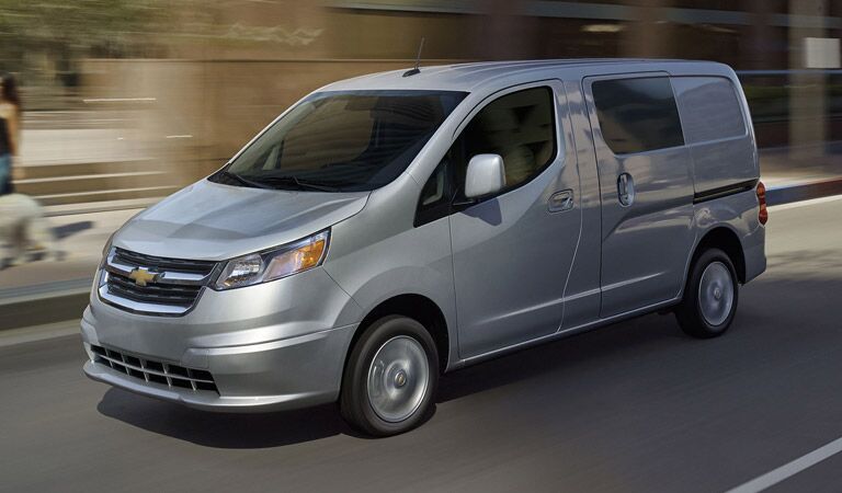 Grey Chevy City Express Van on the street