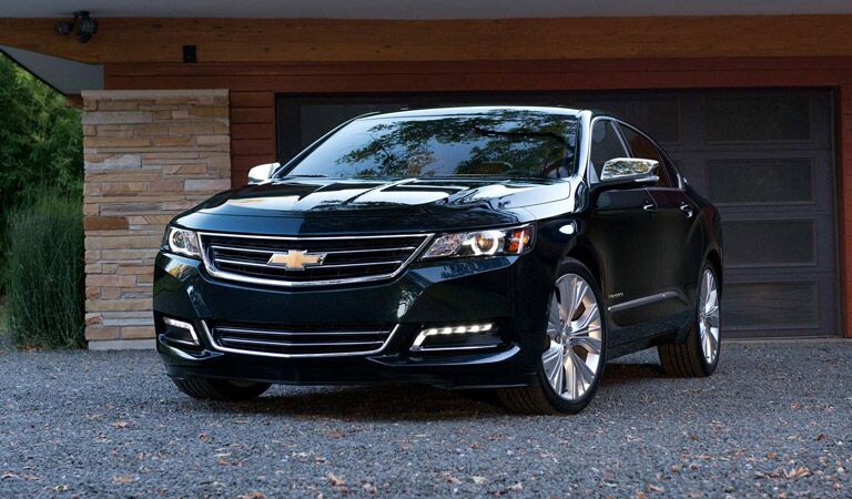 Black Chevy Impala sedan just out of the garage