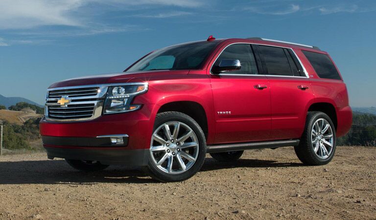 Red Chevy Tahoe off-road in the desert
