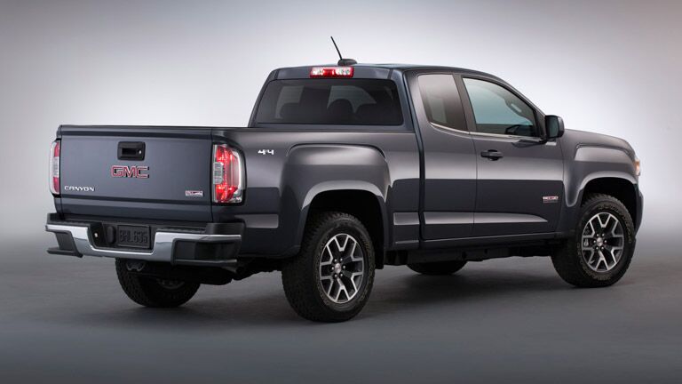 2015 GMC Canyon from the rear against a grey field