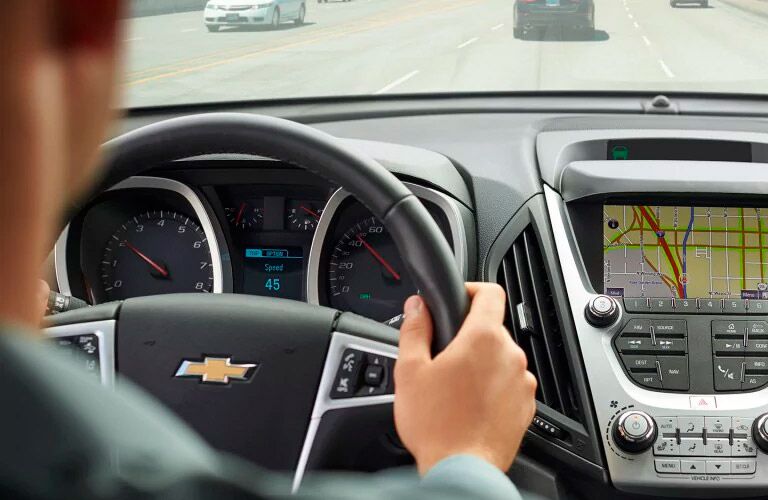 person holding a steering wheel properly in a 2017 Chevy Equinox winnipeg, mb