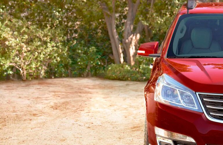front of a red 2017 Chevy Traverse Winnipeg, MB