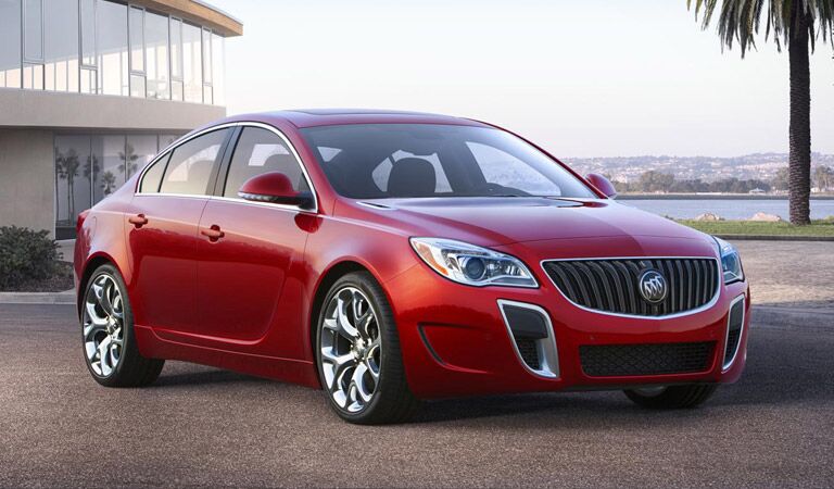 Red Buick Regal by the beach