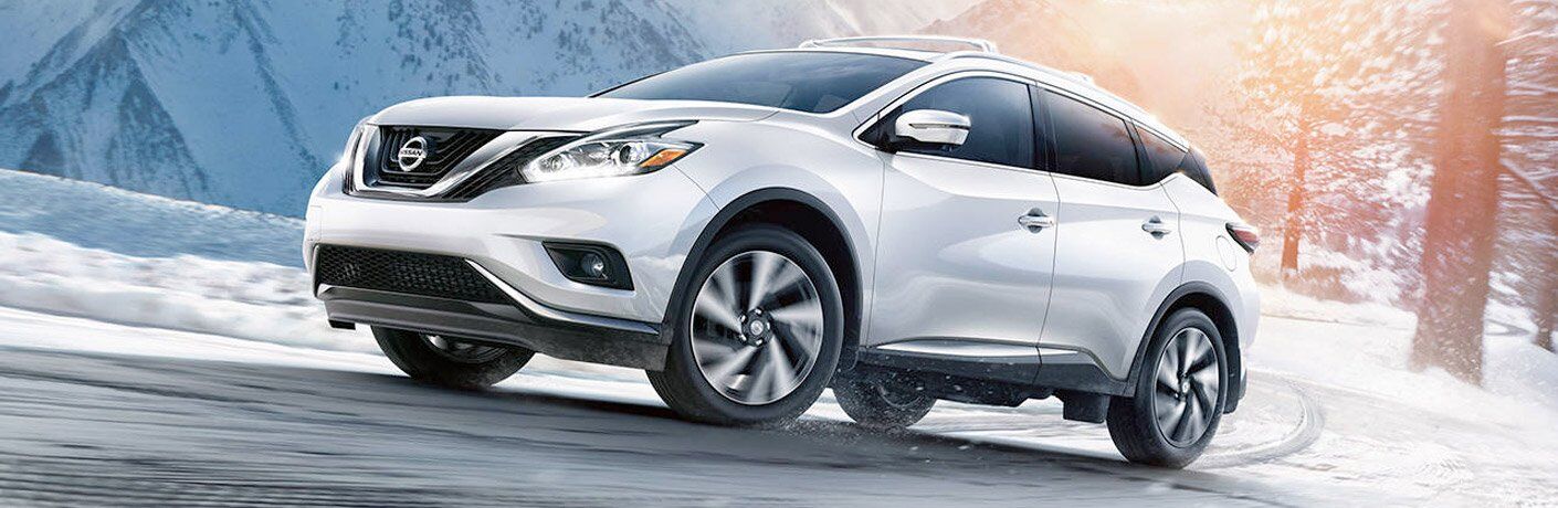 white 2017 Nissan Murano driving on snowy road