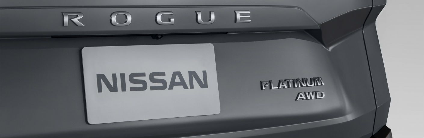 A photo of the Rogue badge and trim badges on the back of the 2021 Nissan Rogue.